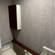 東京都大田区のマンションO様邸｜トイレクロス張り替え後の内装全景。サンゲツRE53585のグレークロスで高級感と落ち着きを演出。